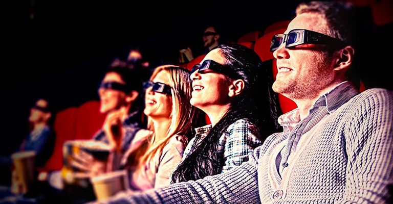 אנשים יושבים באולם קולנוע עם משקפי תלת ממד